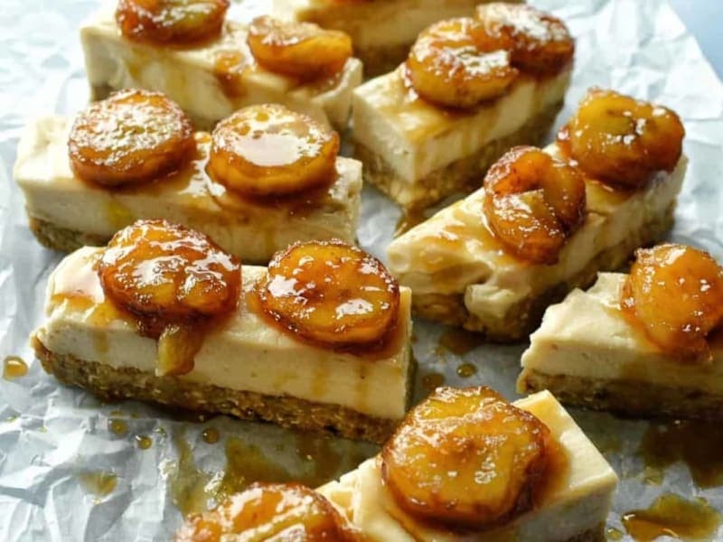 Raw coconut cheesecake bars with rum flambe bananas