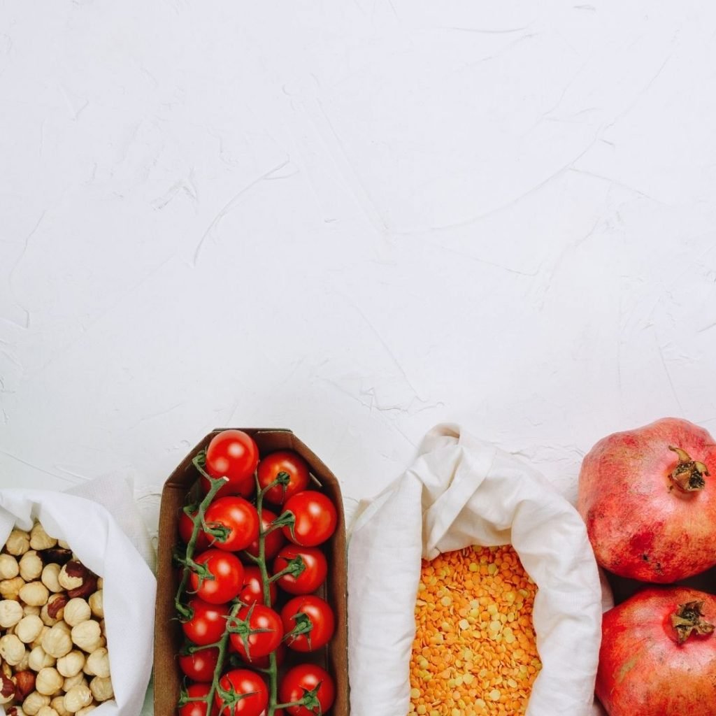 Nuts, tomatoes on the vine, lentils and pommegranite