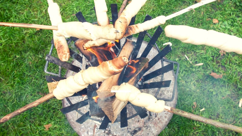 Bread on a stick over a campfire