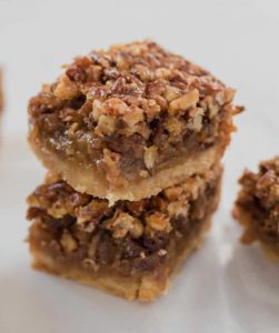 Stack of maple syrup pecan pie bars